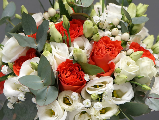 Bridal bouquet with orange roses, eustoma, gypsophila and eucalyptus photo